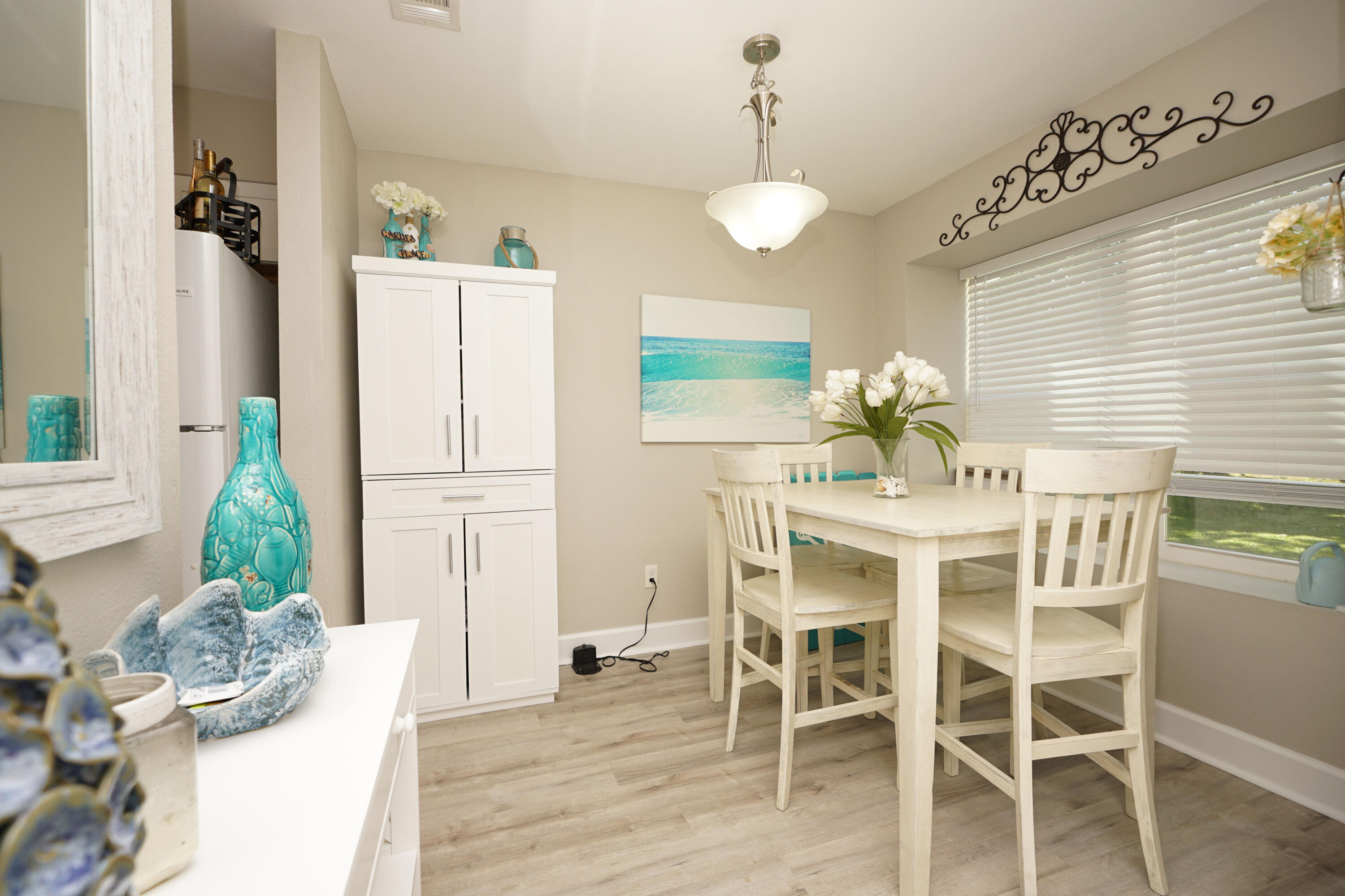 1503 Green Acres Boulevard, Unit E Fort Walton Beach, FL 32547 - Photo 5 of 25 a dining room with furniture and window