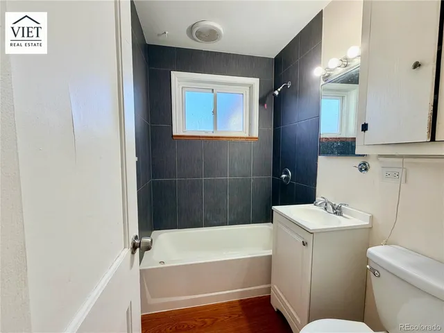 a bathroom with a sink a toilet and bathtub