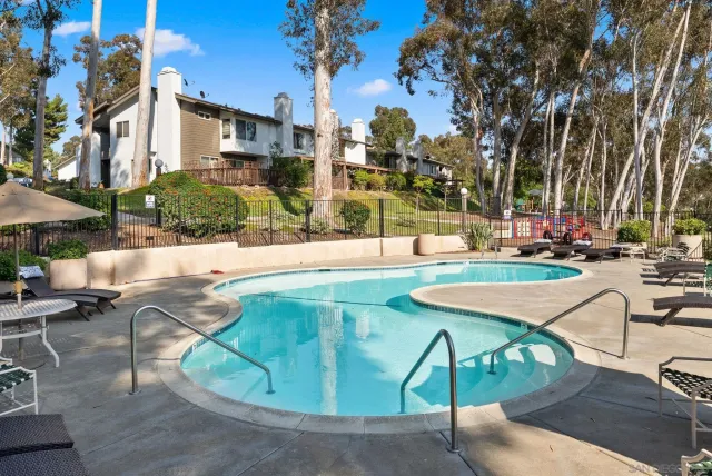 a view of a backyard with sitting area
