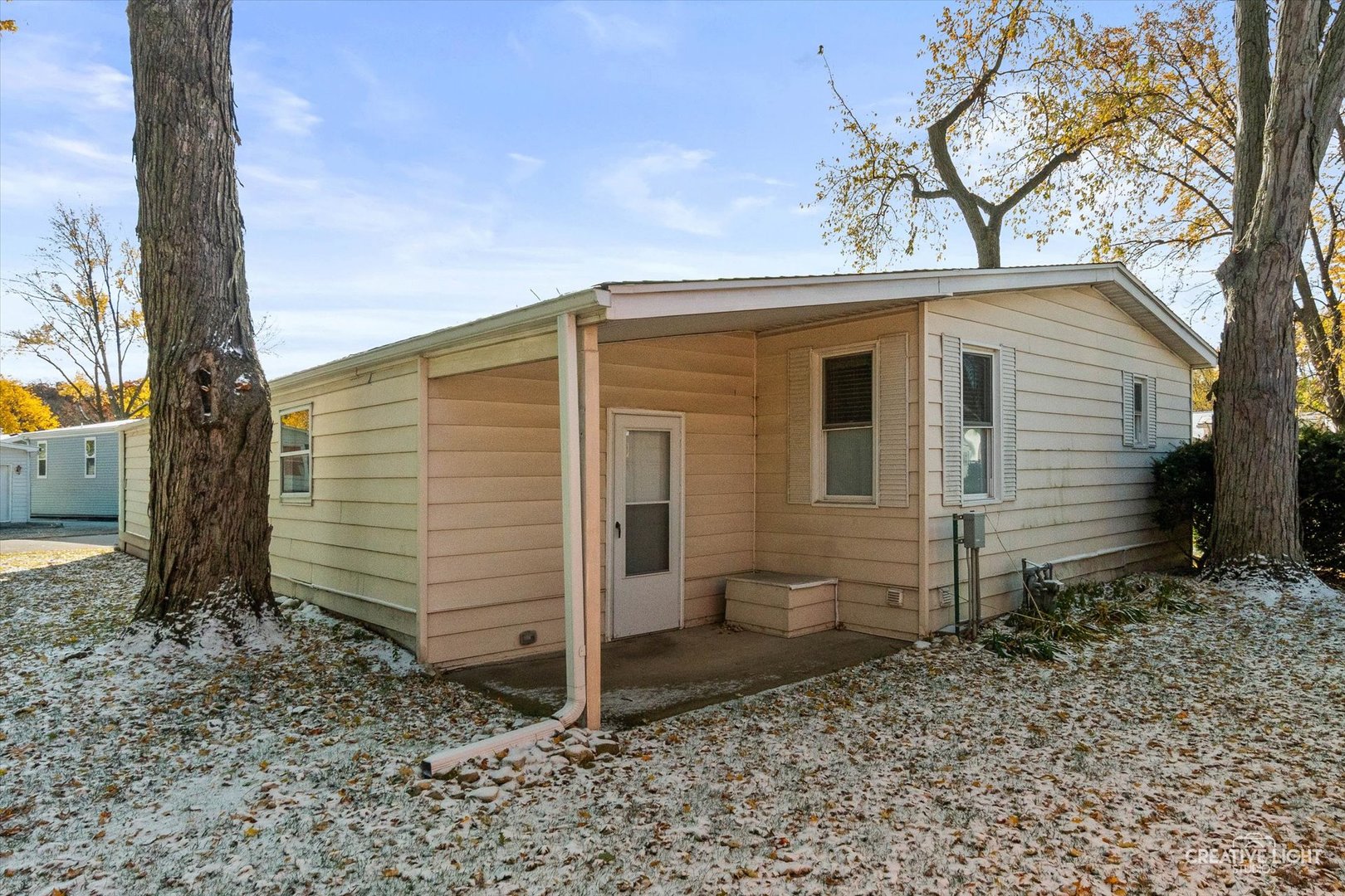 1122 Candida Road Elgin, IL 60123 - Photo 14 of 16 a view of a small house with a window and wooden fence