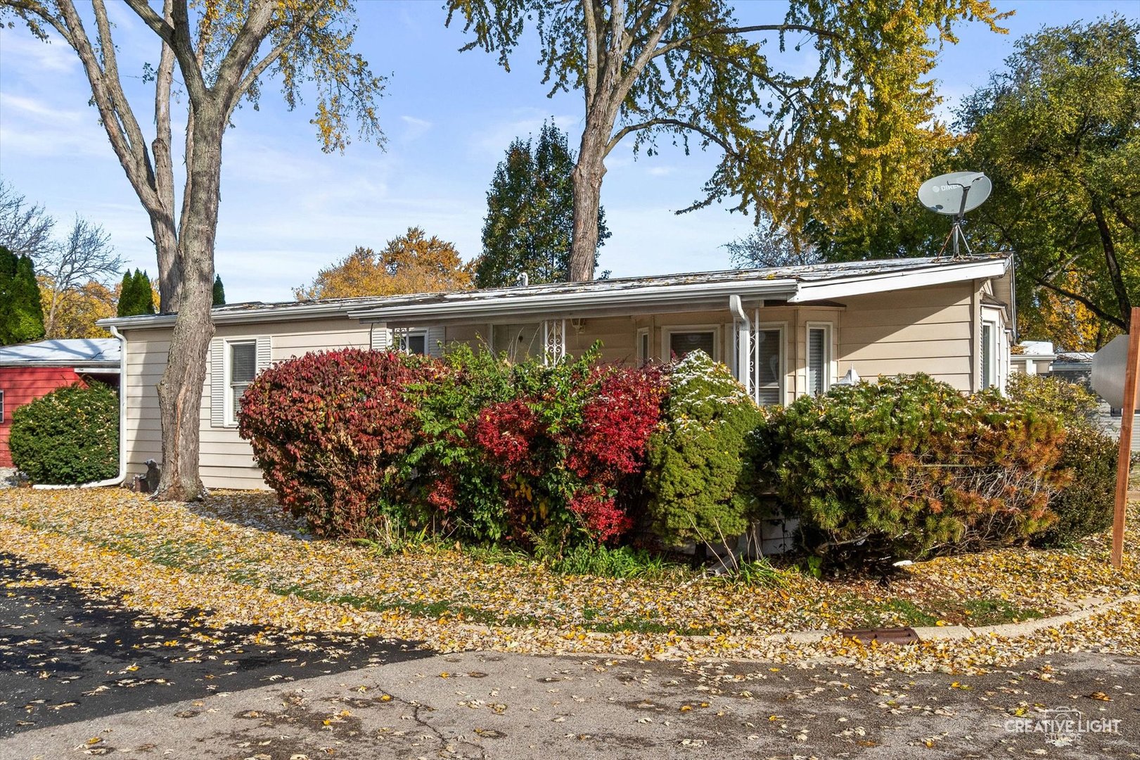 1122 Candida Road Elgin, IL 60123 - Photo 15 of 16 a view of a wooden house with a flower garden