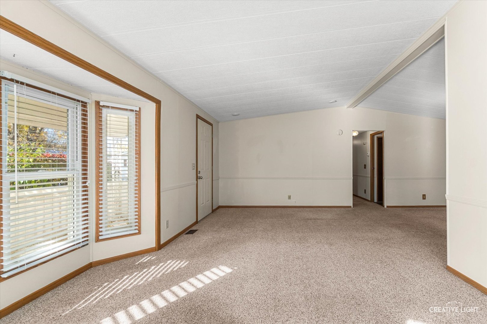 1122 Candida Road Elgin, IL 60123 - Photo 4 of 16 a view of an empty room with a window