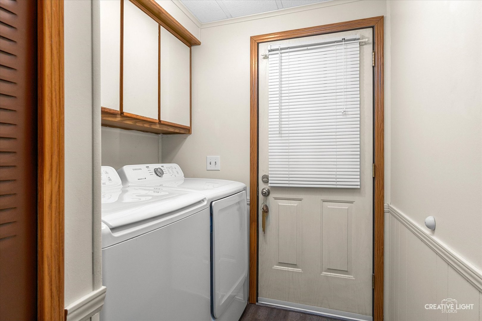1122 Candida Road Elgin, IL 60123 - Photo 7 of 16 a utility room with a window dryer and washer