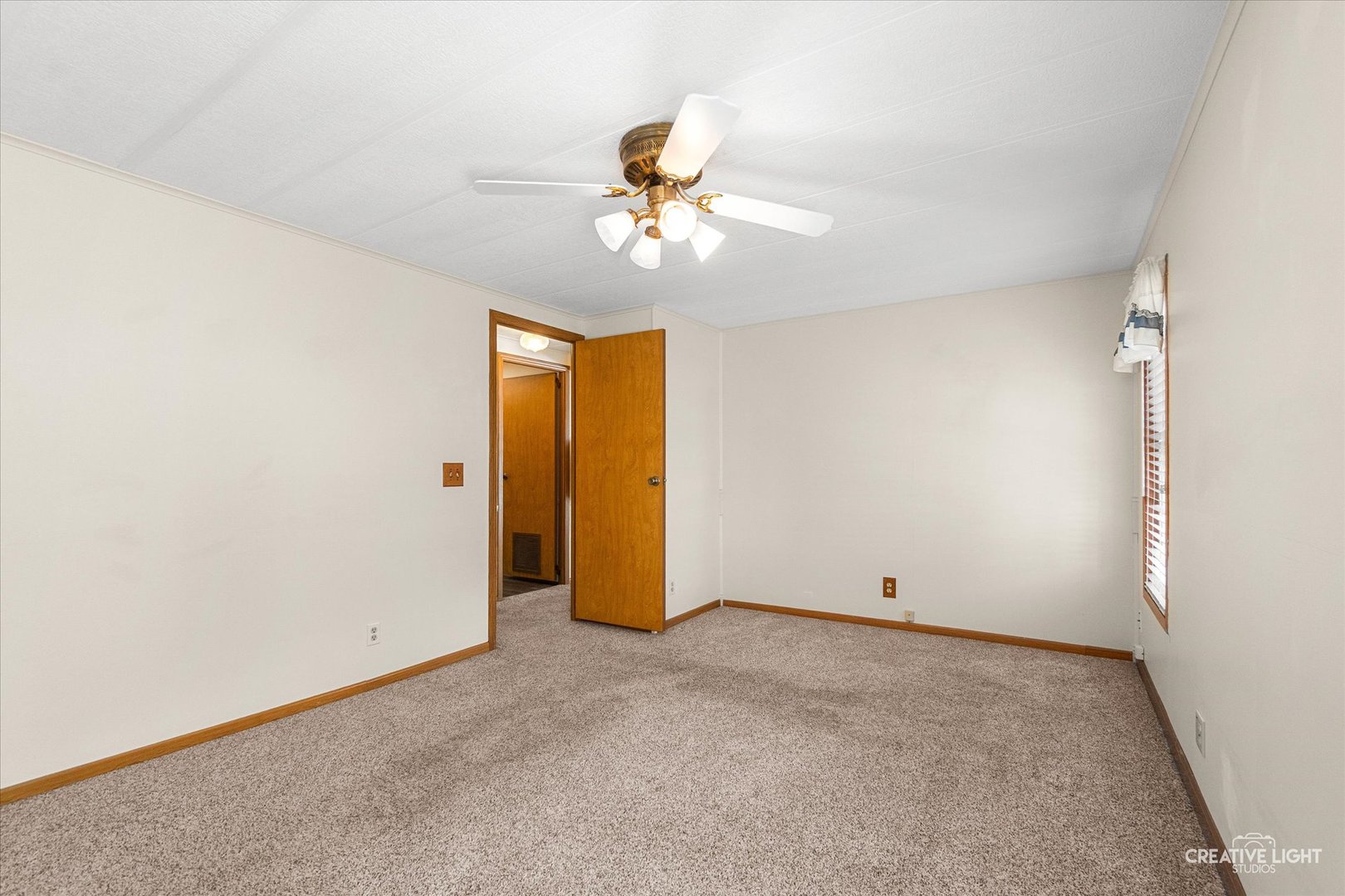 1122 Candida Road Elgin, IL 60123 - Photo 9 of 16 an empty room with closet and windows