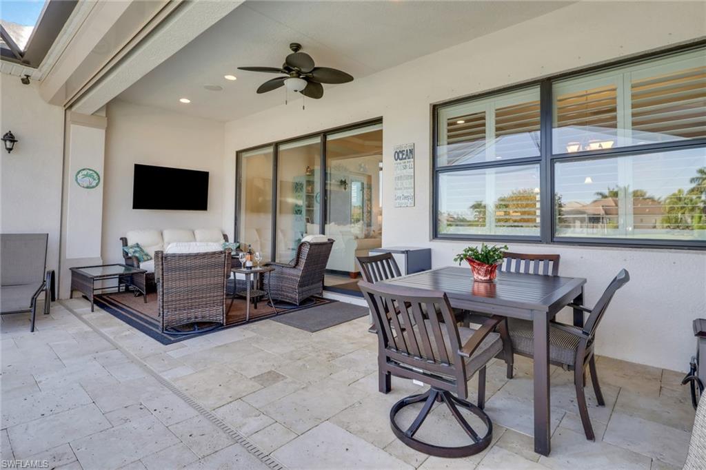 1589 Serrano Circle Naples, FL 34105 - Photo 30 of 38 a view of a dining room with furniture window and outside view