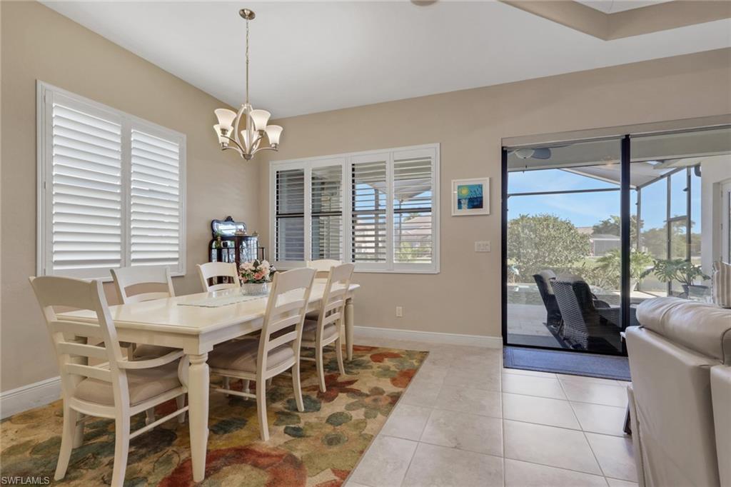 1589 Serrano Circle Naples, FL 34105 - Photo 9 of 38 a view of a dining room with furniture window and outside view