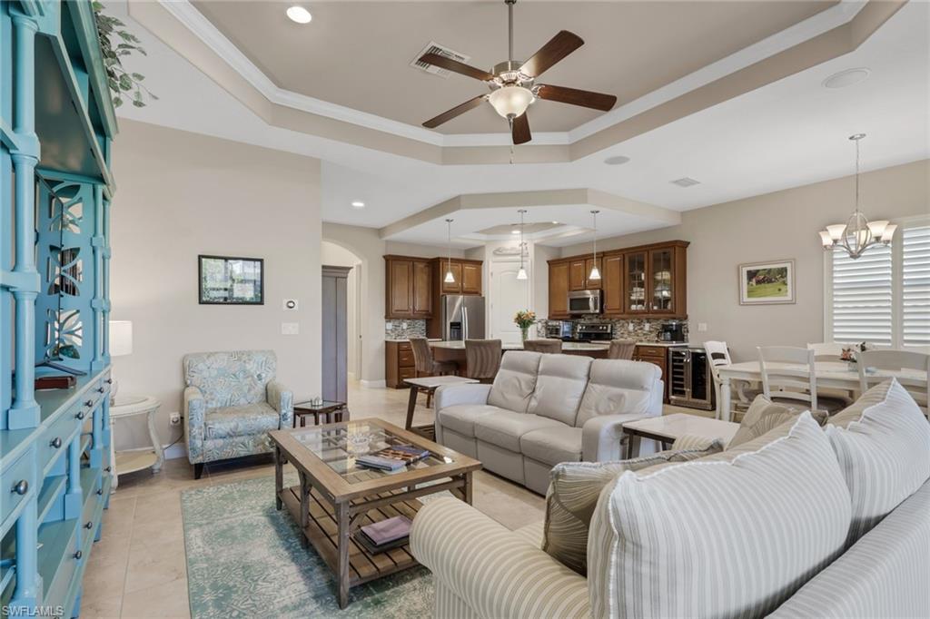 1589 Serrano Circle Naples, FL 34105 - Photo 10 of 38 a living room with furniture