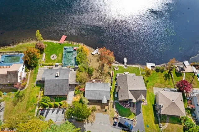 an aerial view of a house with yard swimming pool and outdoor seating
