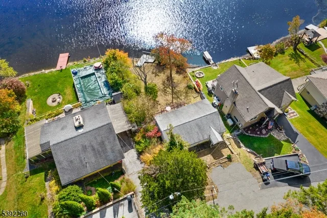 an aerial view of houses with yard