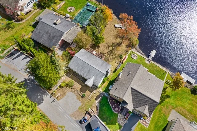 an aerial view of house with yard
