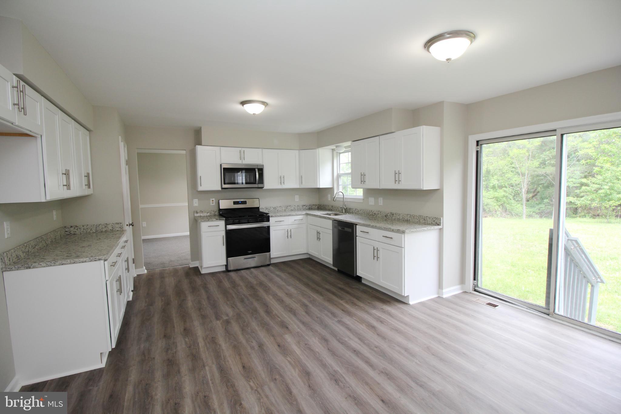 7 Edgewater Court Sicklerville, NJ 08081 - Photo 13 of 44 Modern kitchen with serene outdoor views.