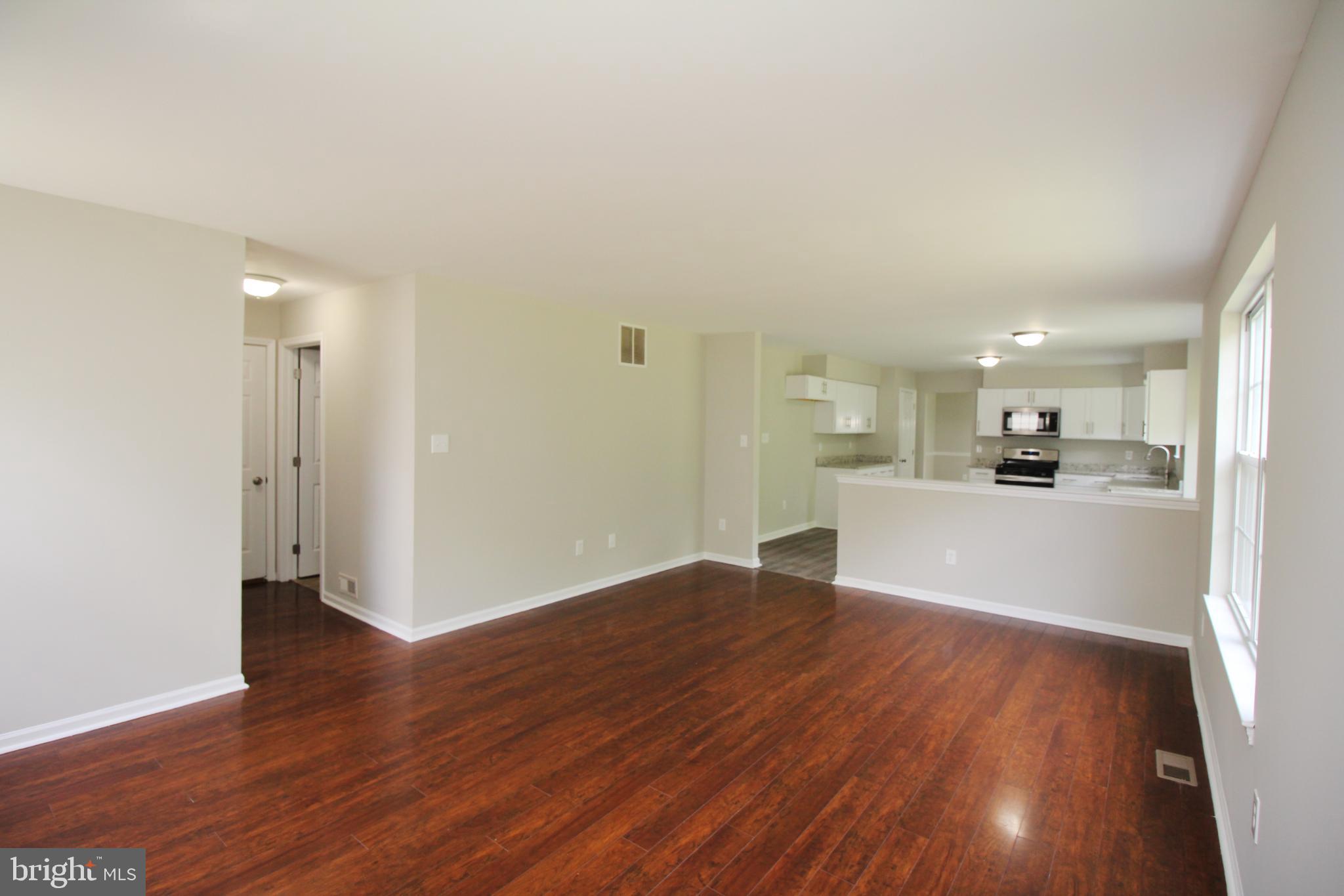 7 Edgewater Court Sicklerville, NJ 08081 - Photo 20 of 44 Spacious, modern living area with warm tones.