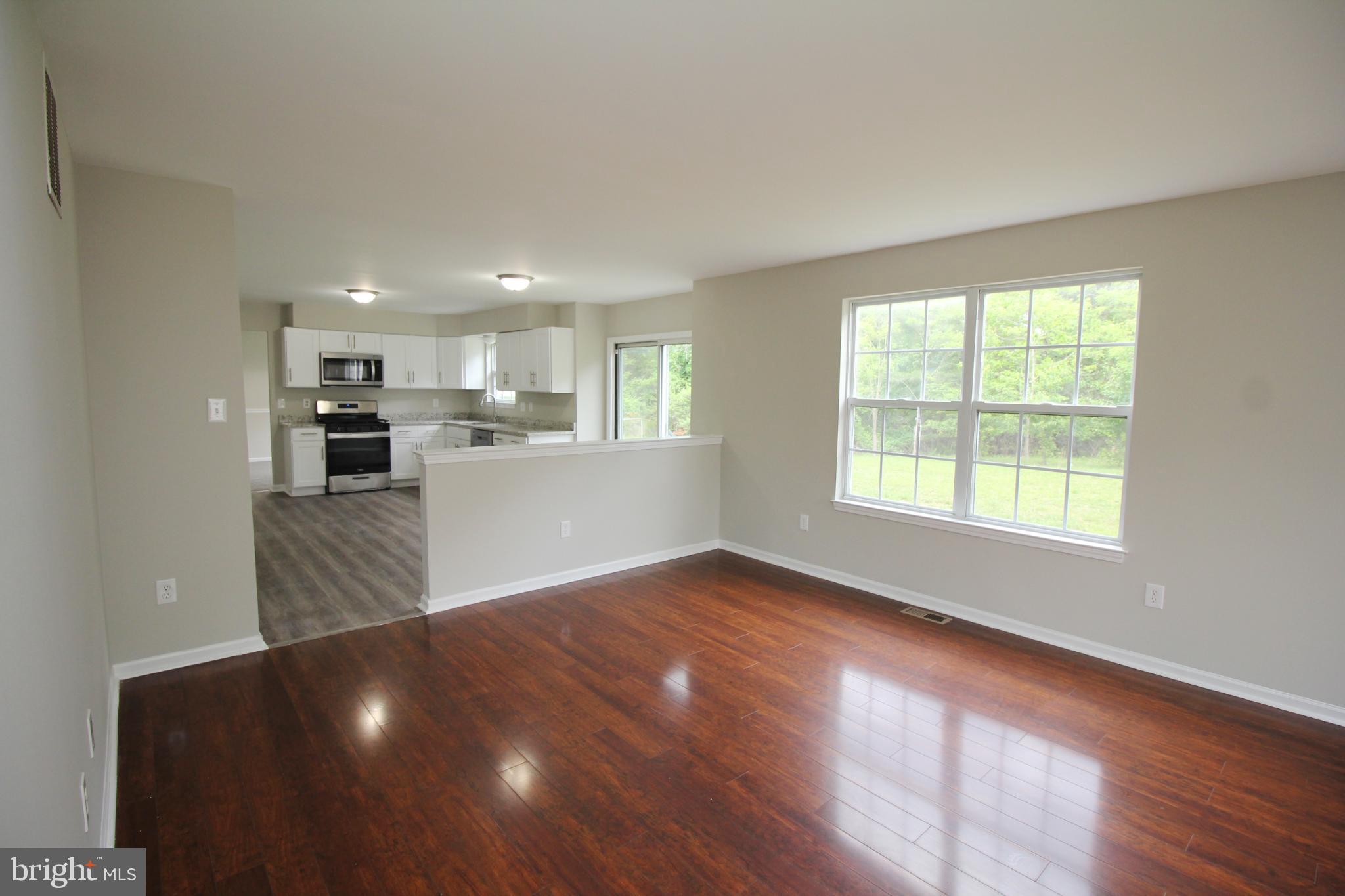7 Edgewater Court Sicklerville, NJ 08081 - Photo 22 of 44 Spacious, sunlit living area with modern kitchen.
