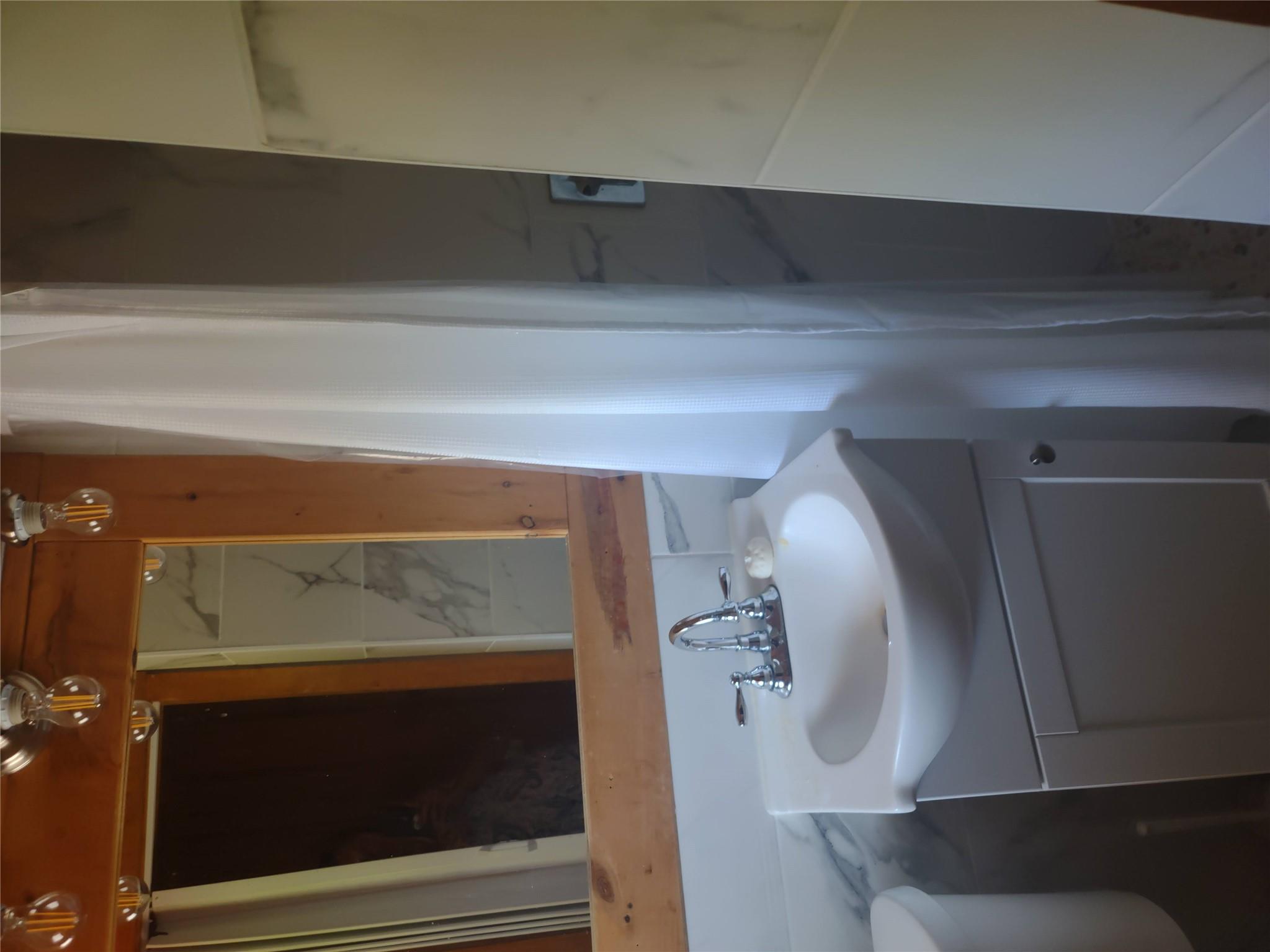 1139 State Rt 17B Mongaup Valley, NY 12762 - Photo 28 of 35 Bathroom featuring vanity and a shower with shower curtain