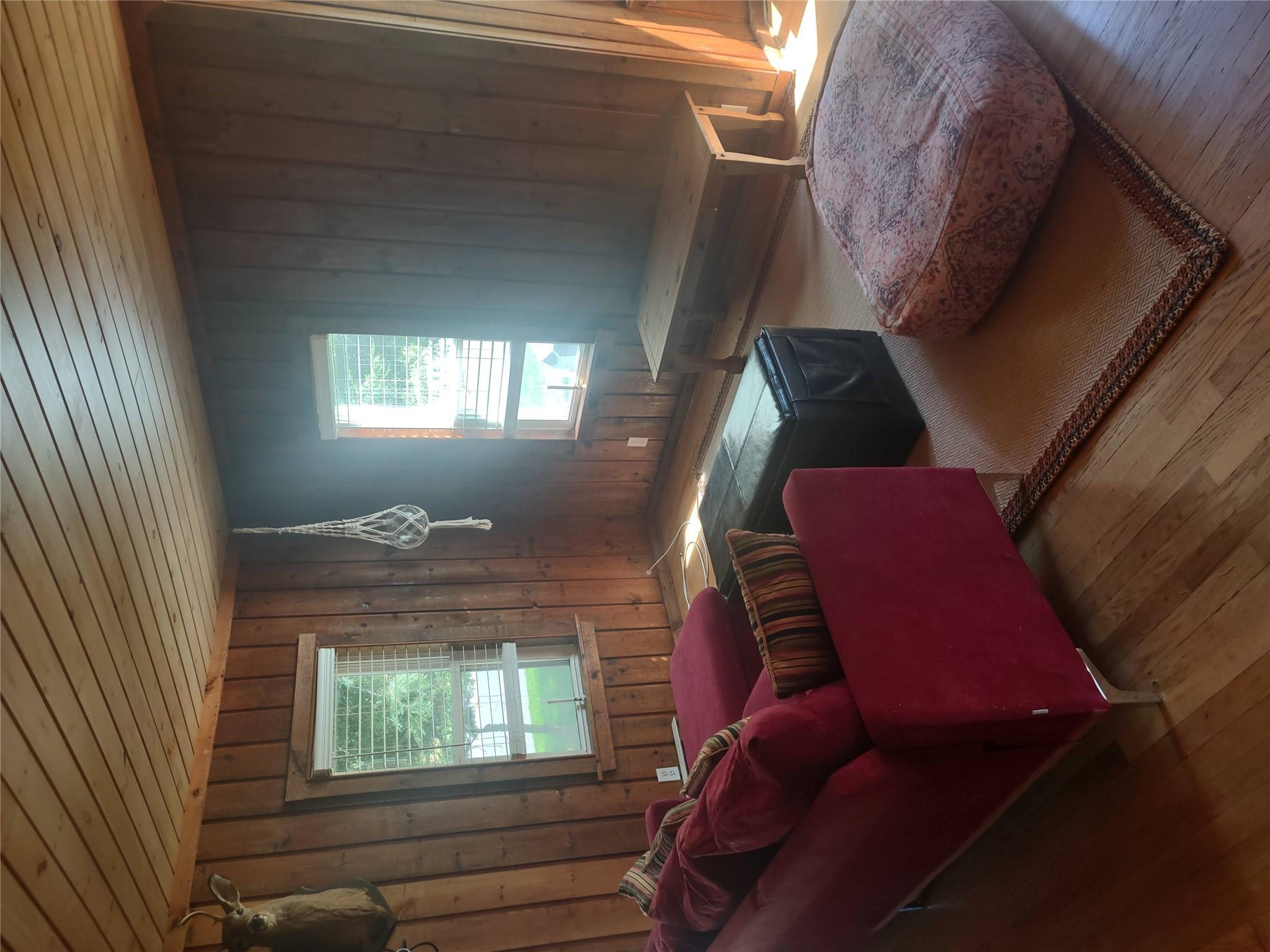 1139 State Rt 17B Mongaup Valley, NY 12762 - Photo 4 of 35 Living room with wood ceiling, wood finished floors, and wood walls