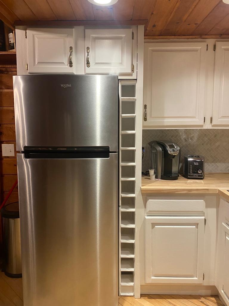 1139 State Rt 17B Mongaup Valley, NY 12762 - Photo 6 of 35 Kitchen featuring freestanding refrigerator, wooden ceiling, light countertops, white cabinets, and tasteful backsplash