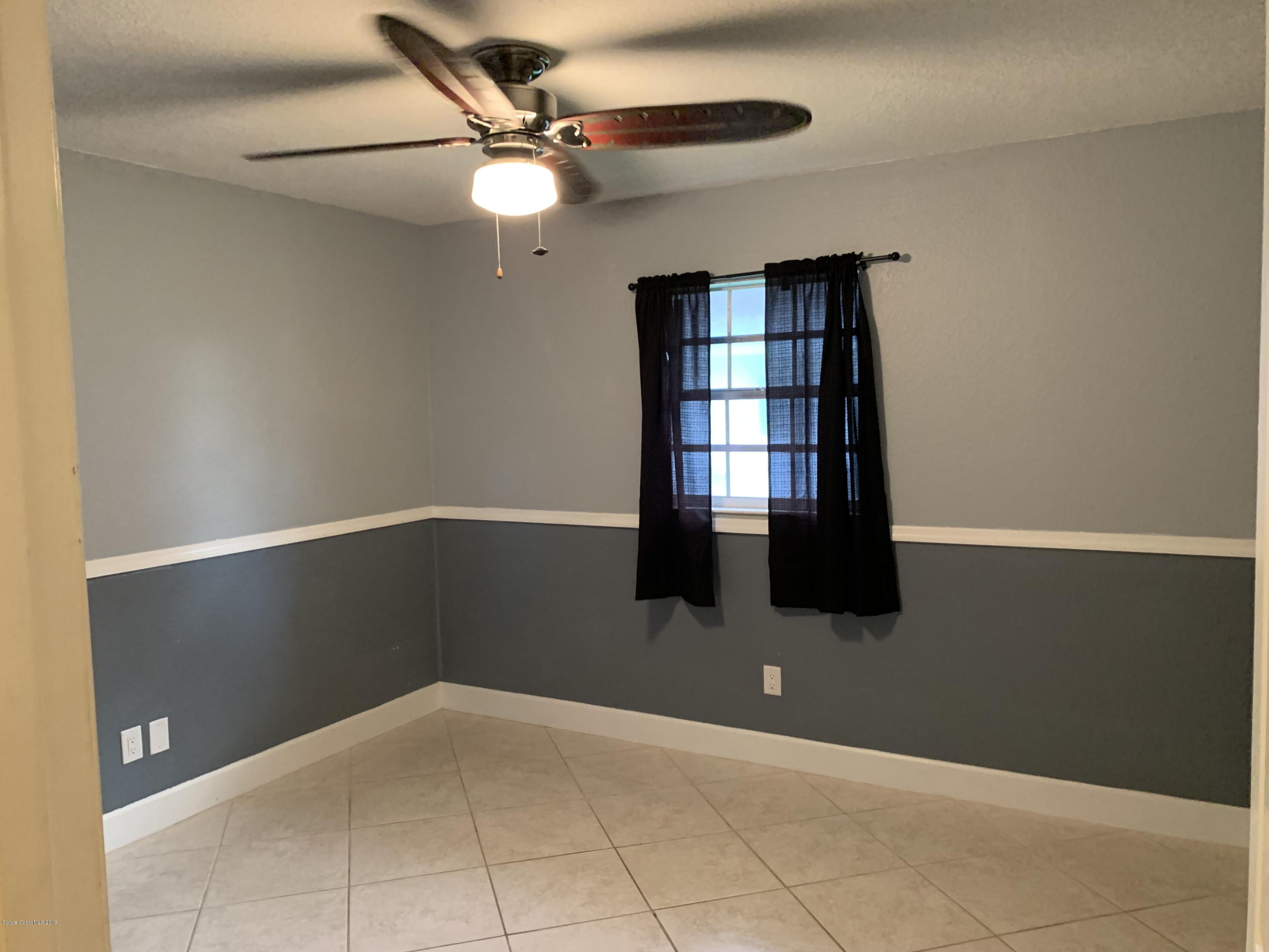 131 13th Avenue Indialantic, FL 32903 - Photo 12 of 23 a view of an empty room with a window