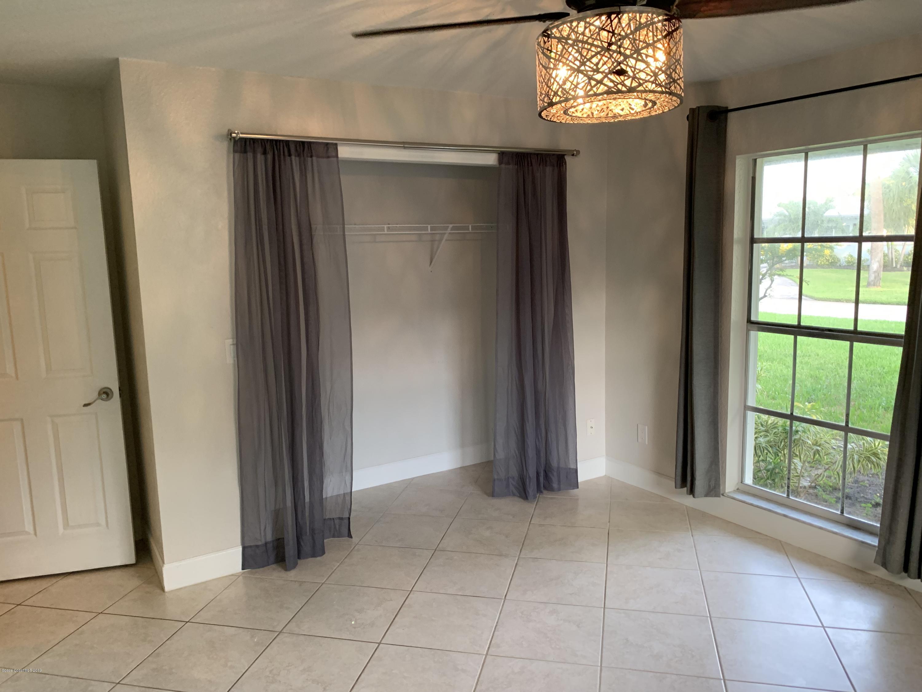 131 13th Avenue Indialantic, FL 32903 - Photo 15 of 23 a view of an empty room with a window