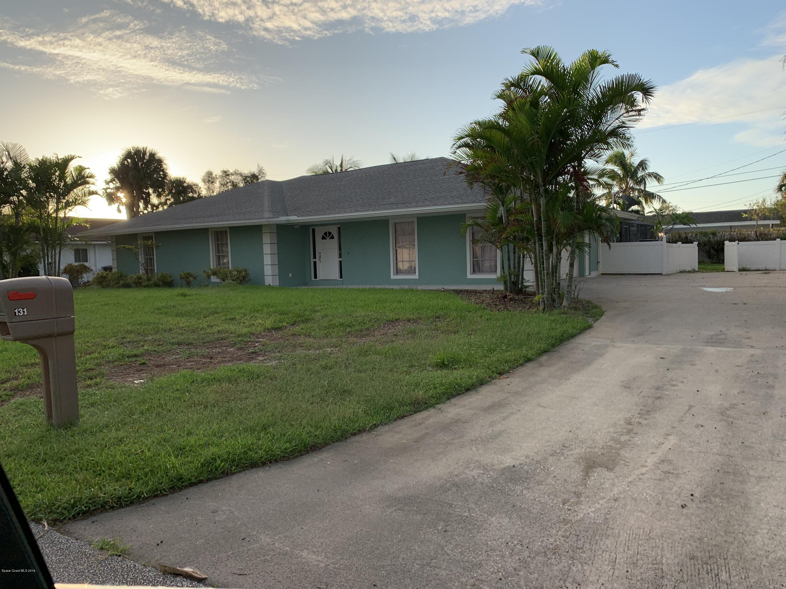 131 13th Avenue Indialantic, FL 32903 - Photo 23 of 23 a front view of a house with a garden and yard