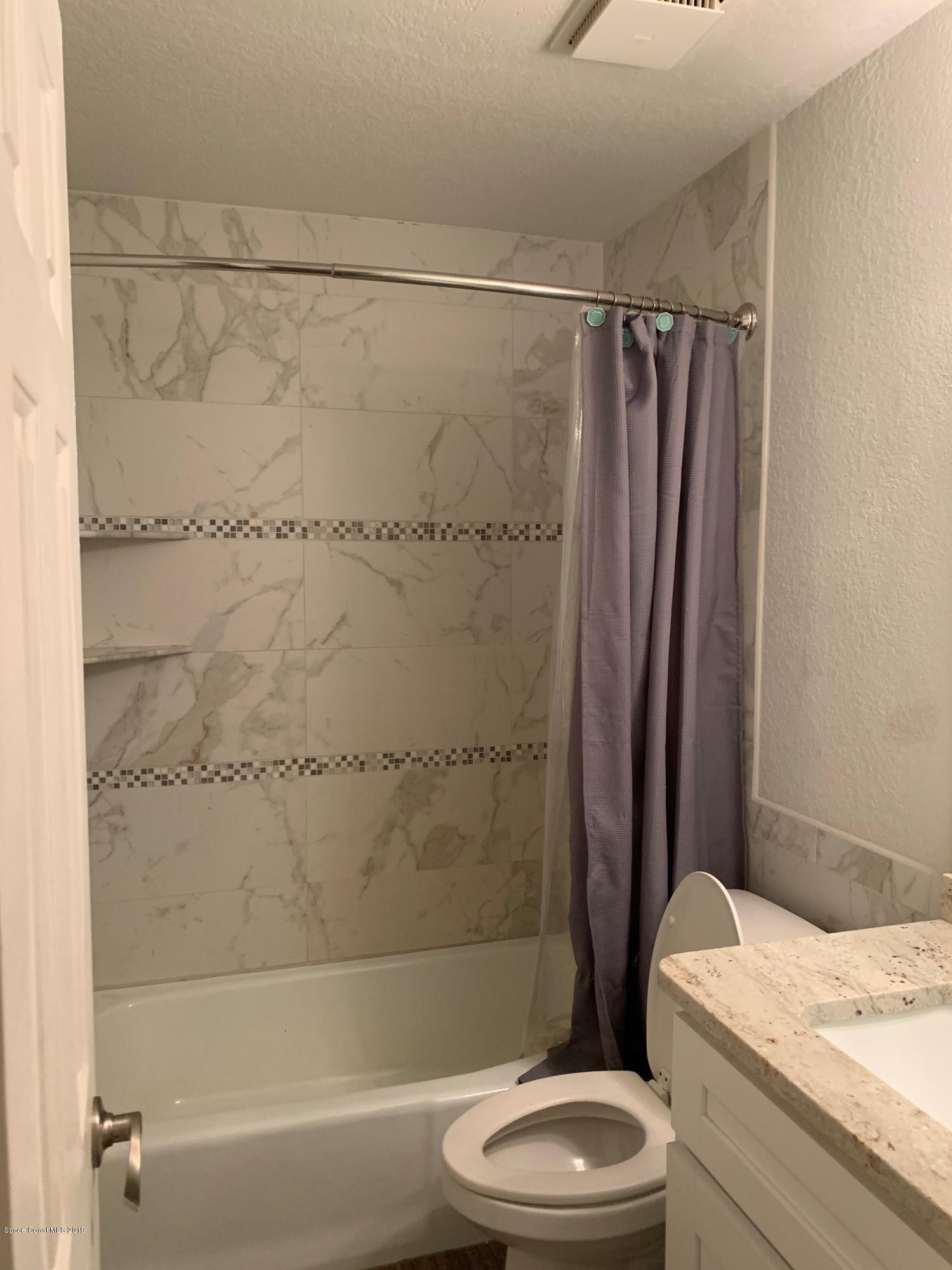 131 13th Avenue Indialantic, FL 32903 - Photo 8 of 23 a bathroom with a toilet a sink and a shower