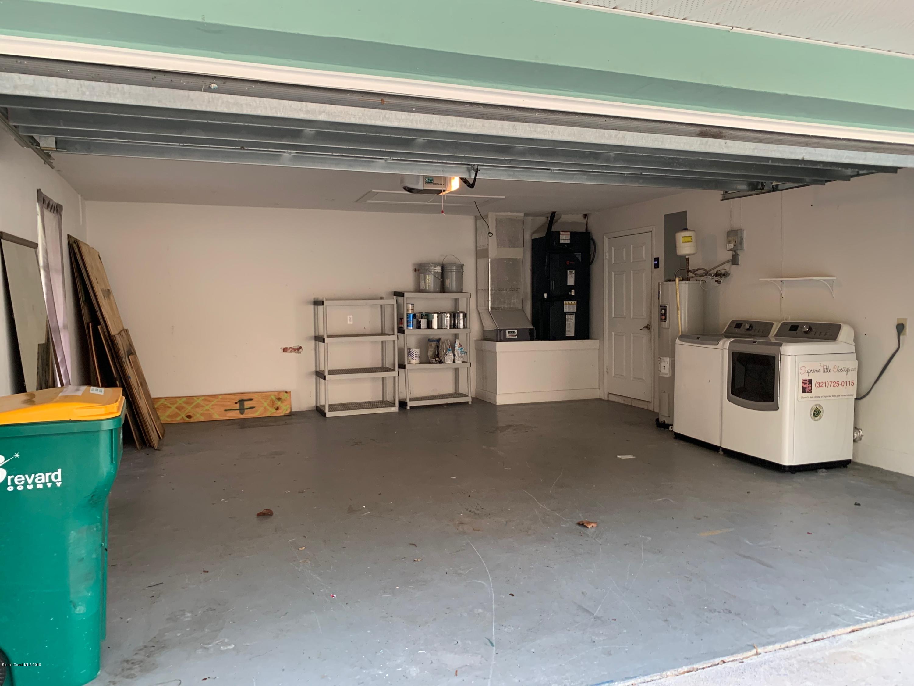 131 13th Avenue Indialantic, FL 32903 - Photo 10 of 23 a view of a car garage