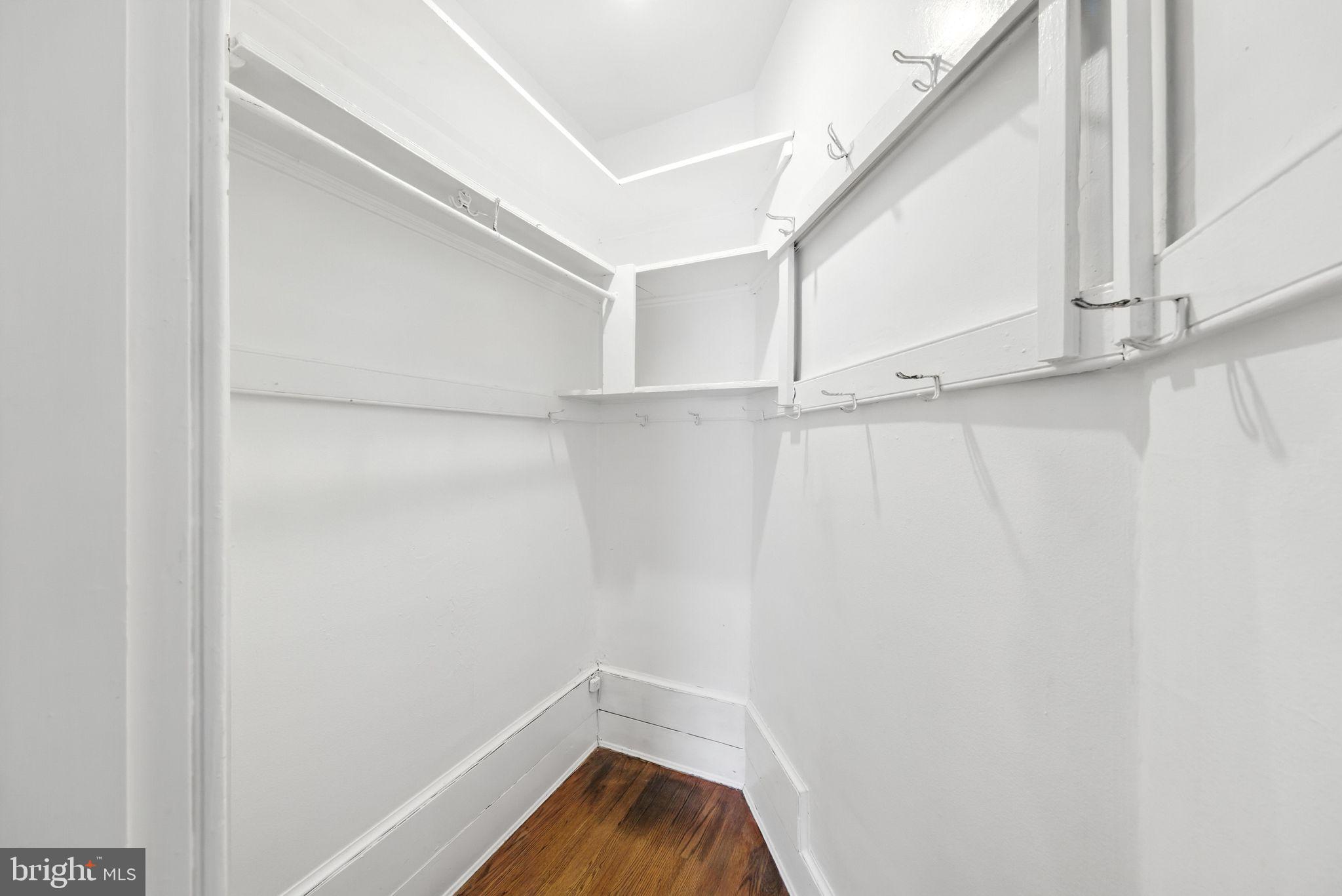 1763 U Street Northwest Washington, DC 20009 - Photo 15 of 28 a view of walk in closet with empty racks
