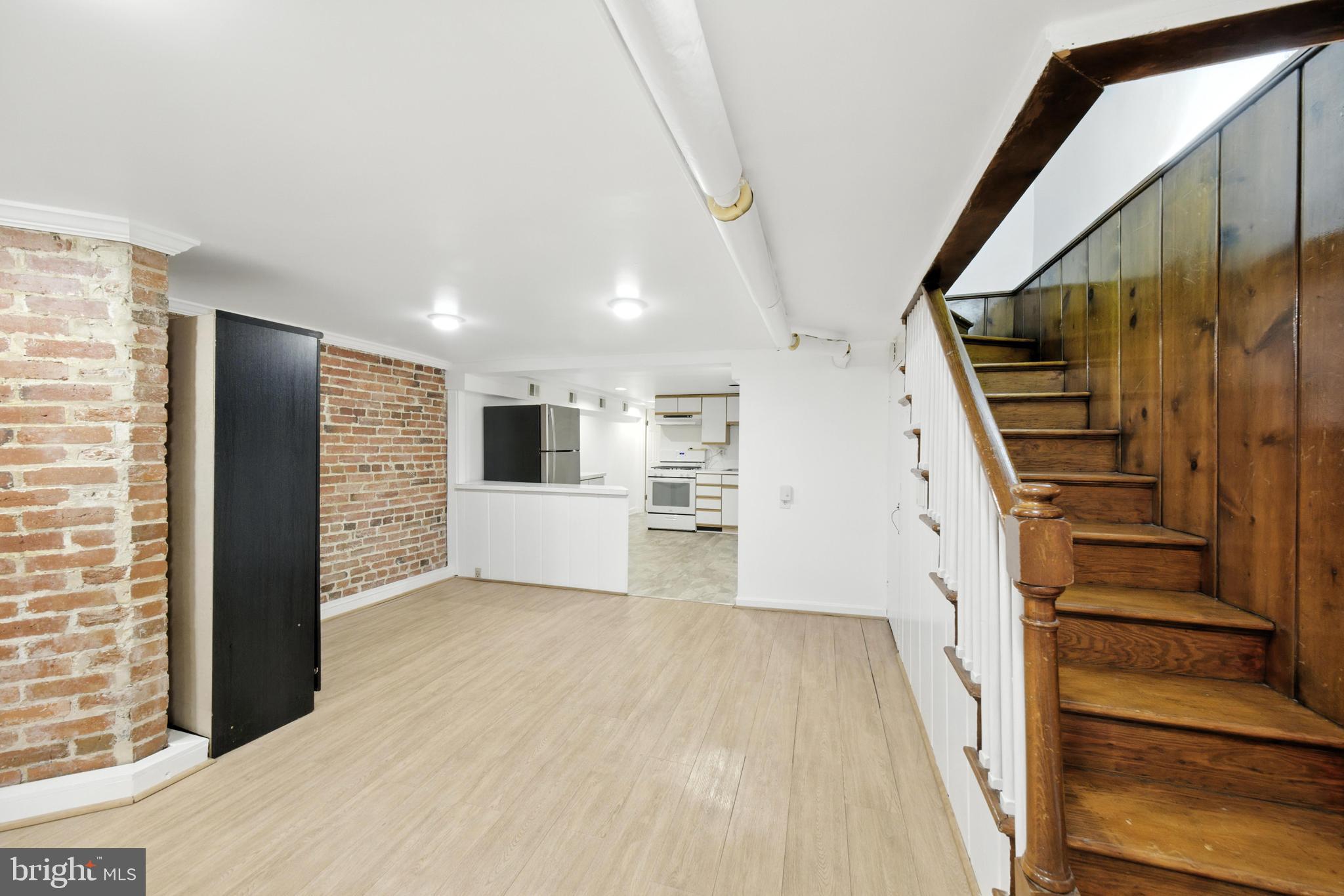 1763 U Street Northwest Washington, DC 20009 - Photo 25 of 28 a view of a kitchen with wooden floor and stairs