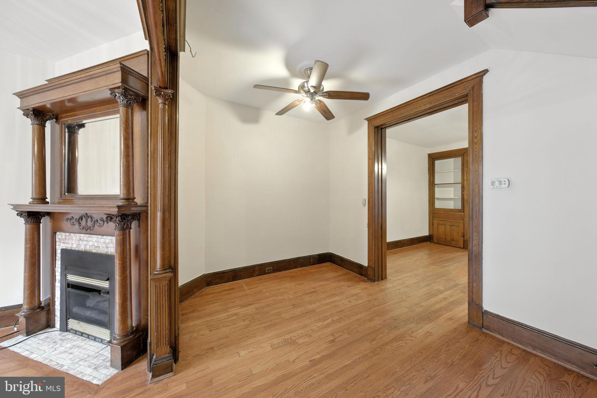 1763 U Street Northwest Washington, DC 20009 - Photo 5 of 28 wooden floor in an empty room with a window
