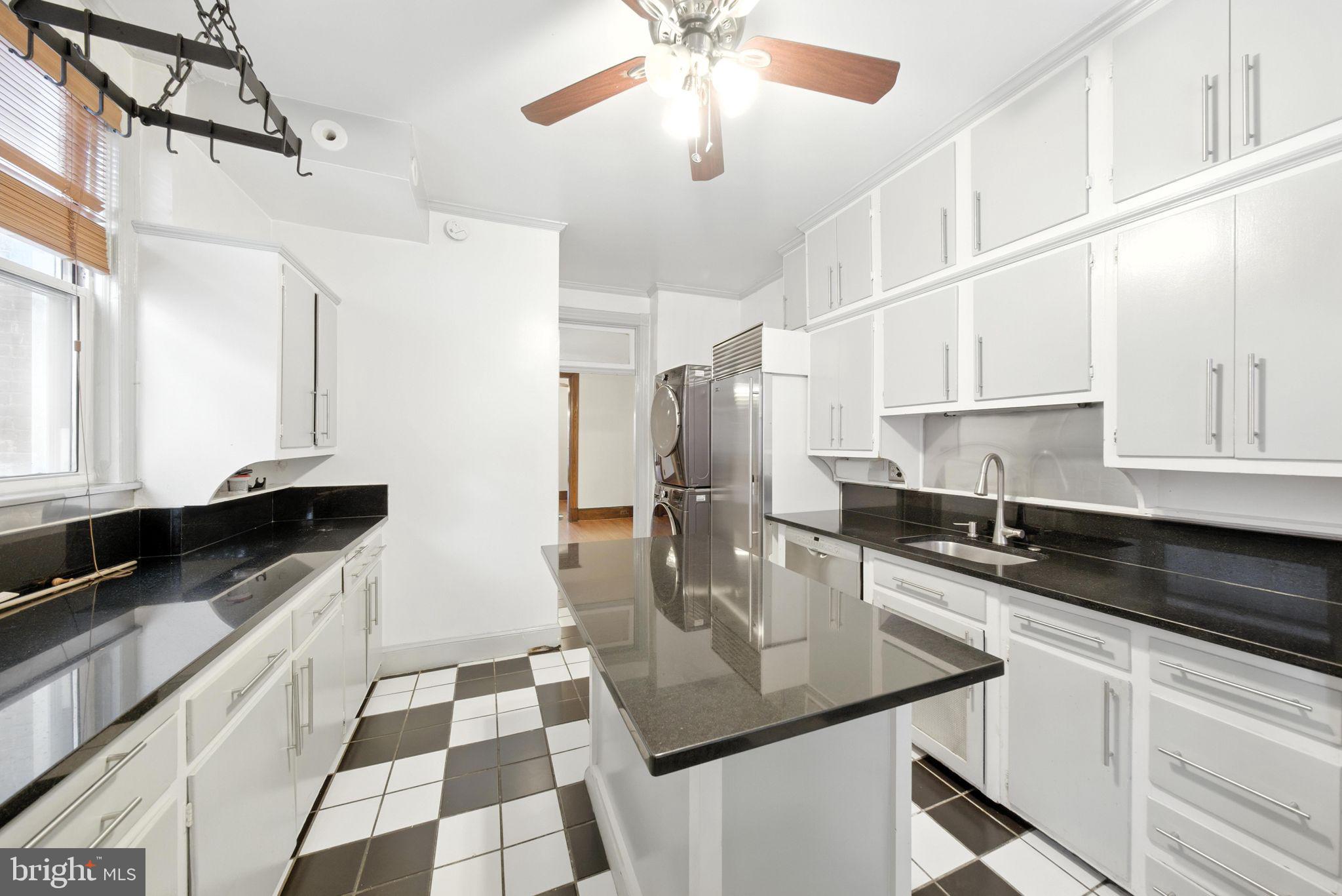 1763 U Street Northwest Washington, DC 20009 - Photo 8 of 28 a kitchen with stainless steel appliances granite countertop a sink and cabinets