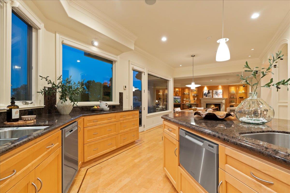 8350 Verbena Drive Gilroy, CA 95020 - Photo 17 of 51 a large kitchen with granite countertop a sink and cabinets