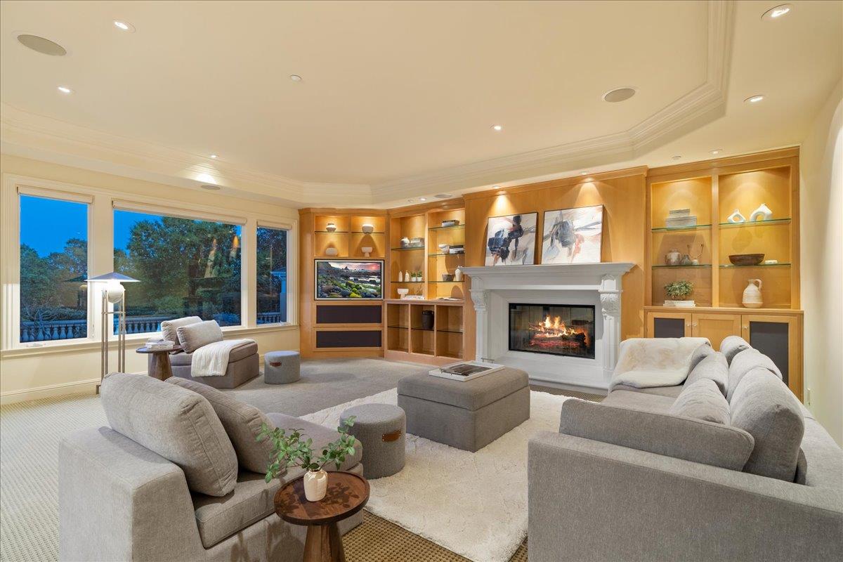 8350 Verbena Drive Gilroy, CA 95020 - Photo 24 of 51 a living room with furniture large windows and a fireplace