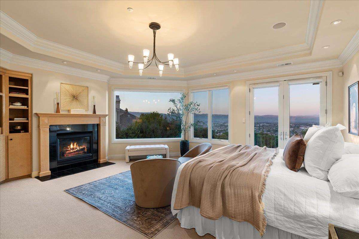 8350 Verbena Drive Gilroy, CA 95020 - Photo 29 of 51 a bedroom with a bed and a fireplace