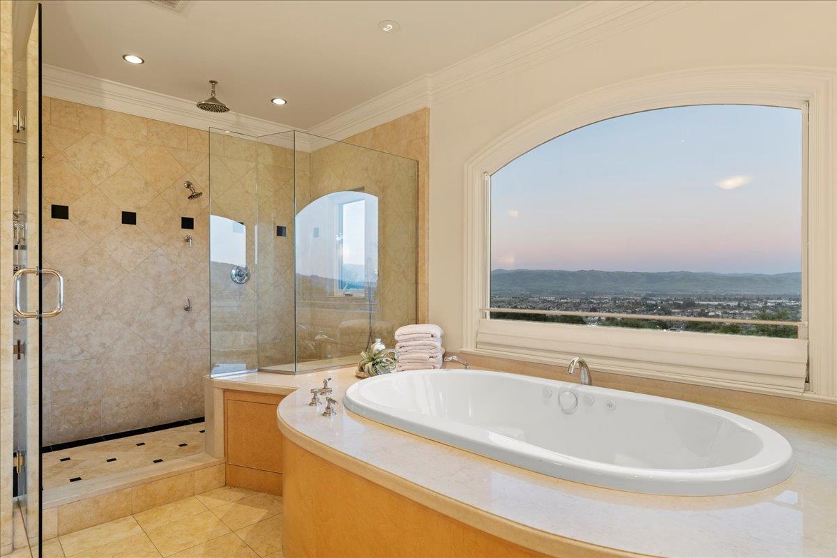 8350 Verbena Drive Gilroy, CA 95020 - Photo 33 of 51 a bathroom with a tub a sink and a shower