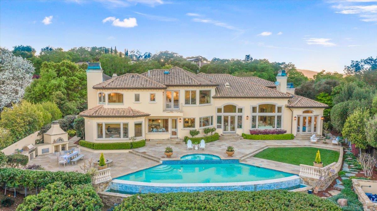 8350 Verbena Drive Gilroy, CA 95020 - Photo 49 of 51 a front view of a house with a yard table and chairs