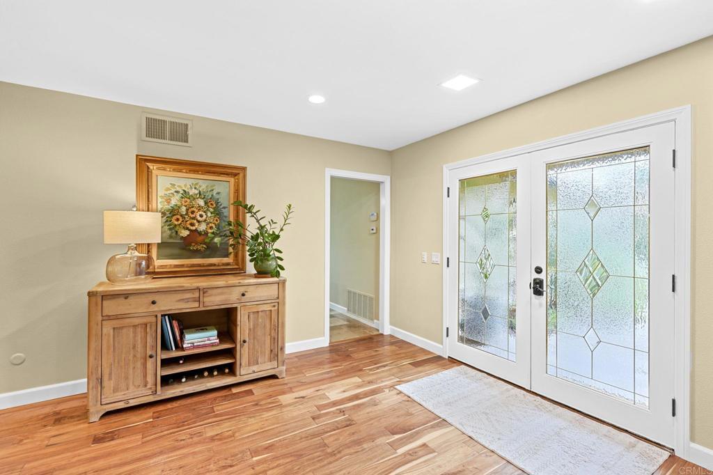 3625 Laketree Drive Fallbrook, CA 92028 - Photo 11 of 52 a view of a livingroom with a fireplace cabinet and window