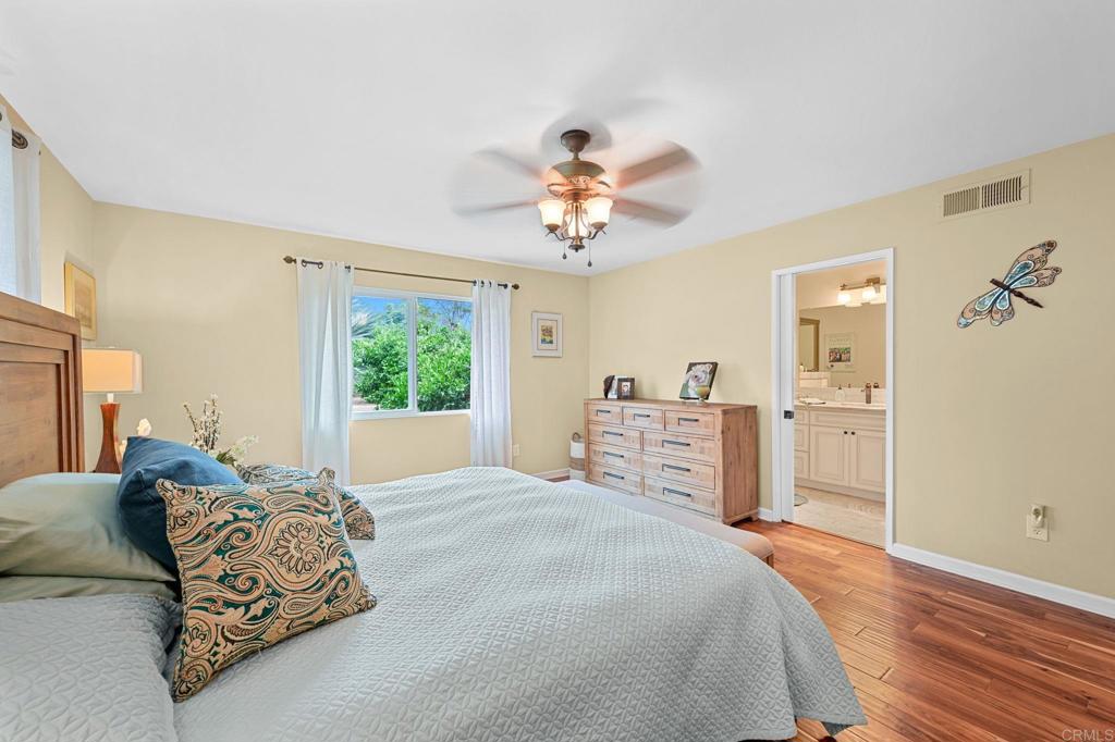 3625 Laketree Drive Fallbrook, CA 92028 - Photo 22 of 52 a bedroom with a large bed and a window