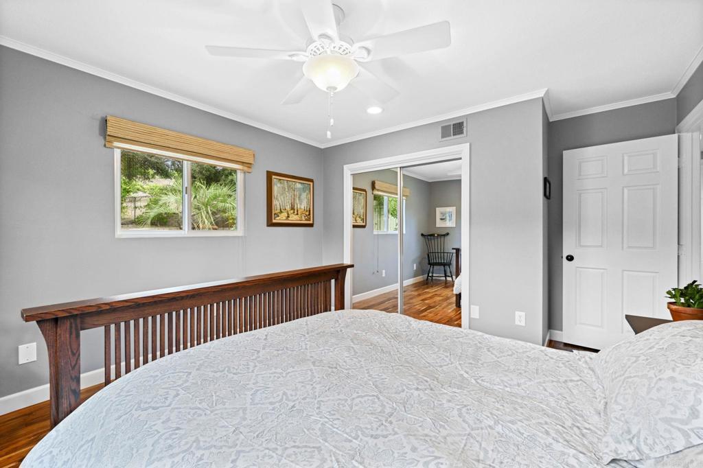 3625 Laketree Drive Fallbrook, CA 92028 - Photo 26 of 52 a bedroom with a bed and a chandelier