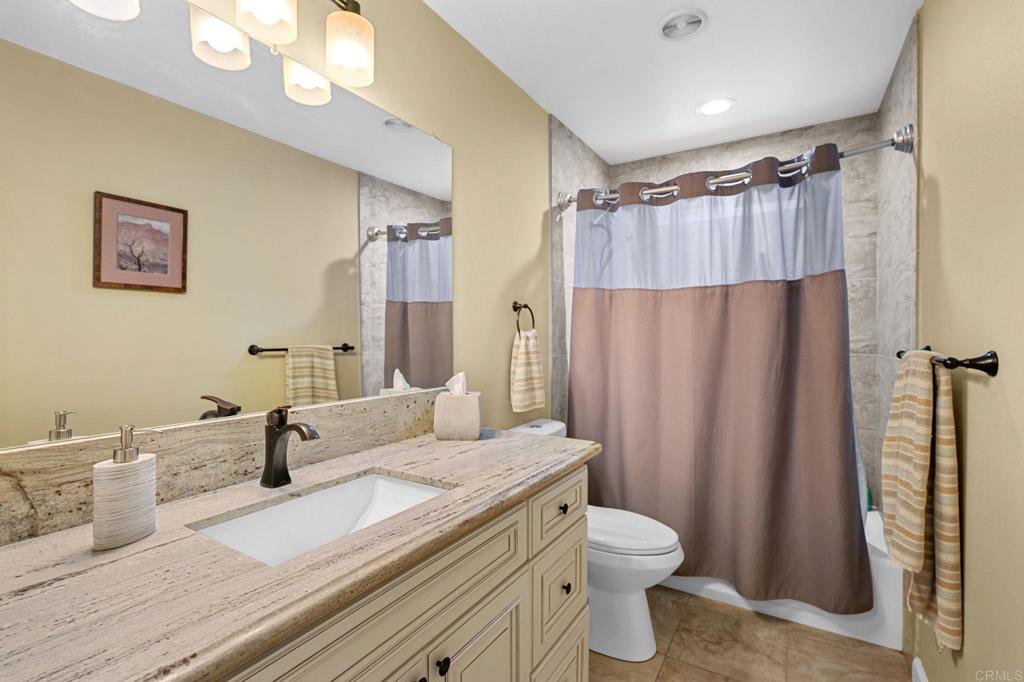 3625 Laketree Drive Fallbrook, CA 92028 - Photo 27 of 52 a bathroom with a double vanity sink toilet and shower