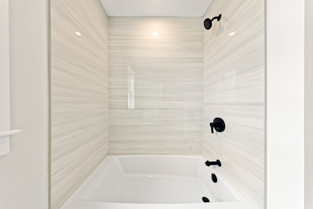2 Old County Road, Unit 12 Salisbury, MA 01952 - Photo 11 of 29 a bathroom with a bathtub
