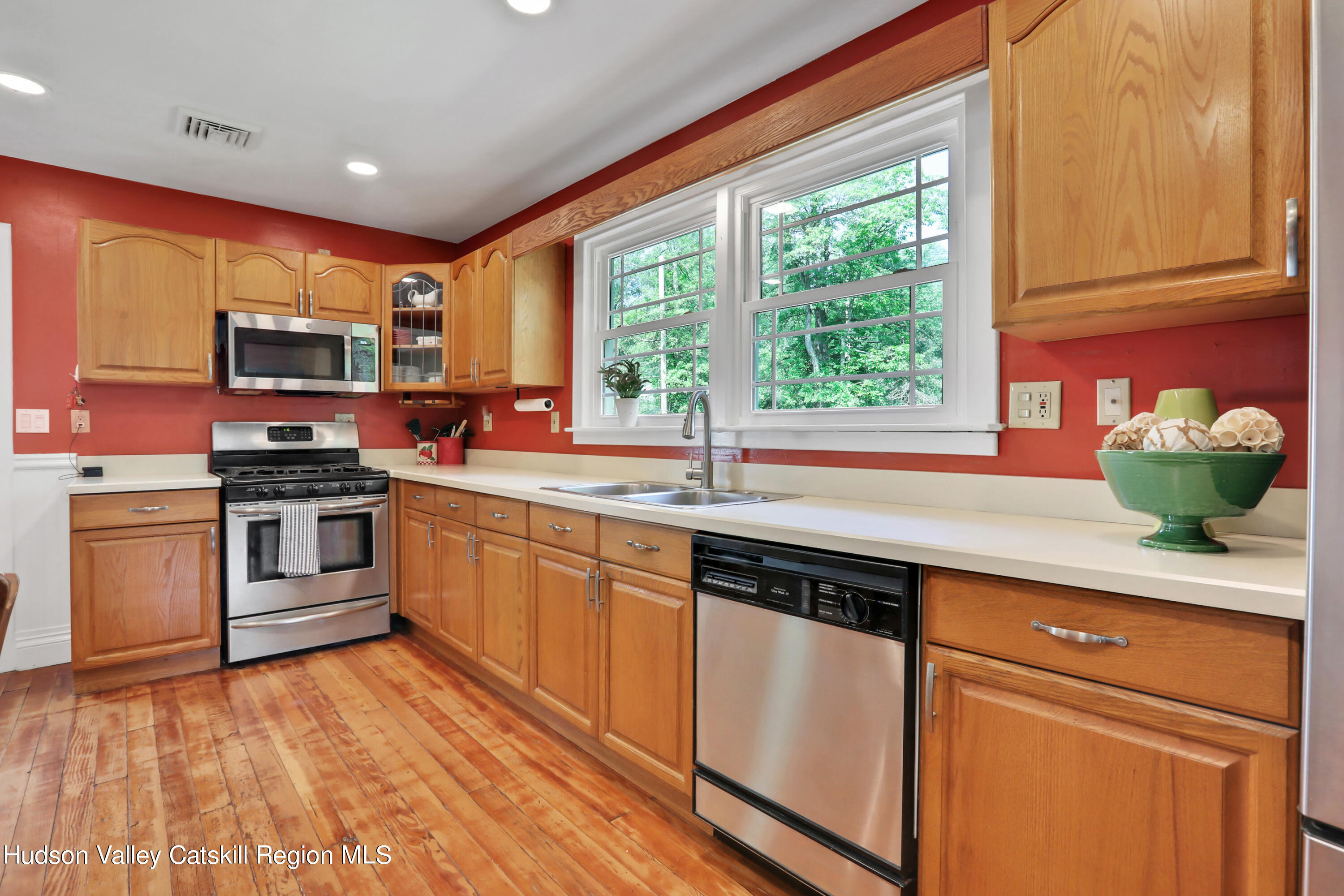 667 Albany Post Road New Paltz, NY 12561 - Photo 13 of 44 a kitchen with stainless steel appliances granite countertop a sink a stove and cabinets
