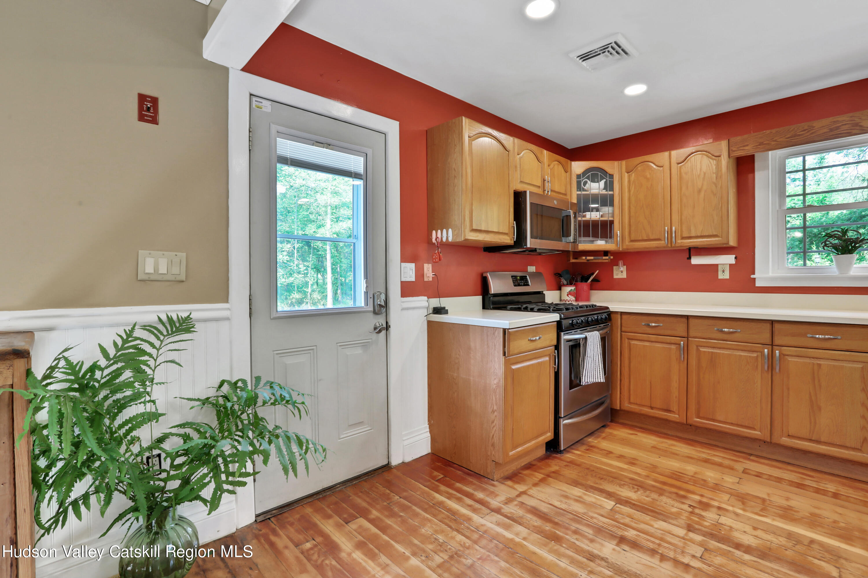 667 Albany Post Road New Paltz, NY 12561 - Photo 16 of 44 a kitchen with a sink cabinets stainless steel appliances and a window