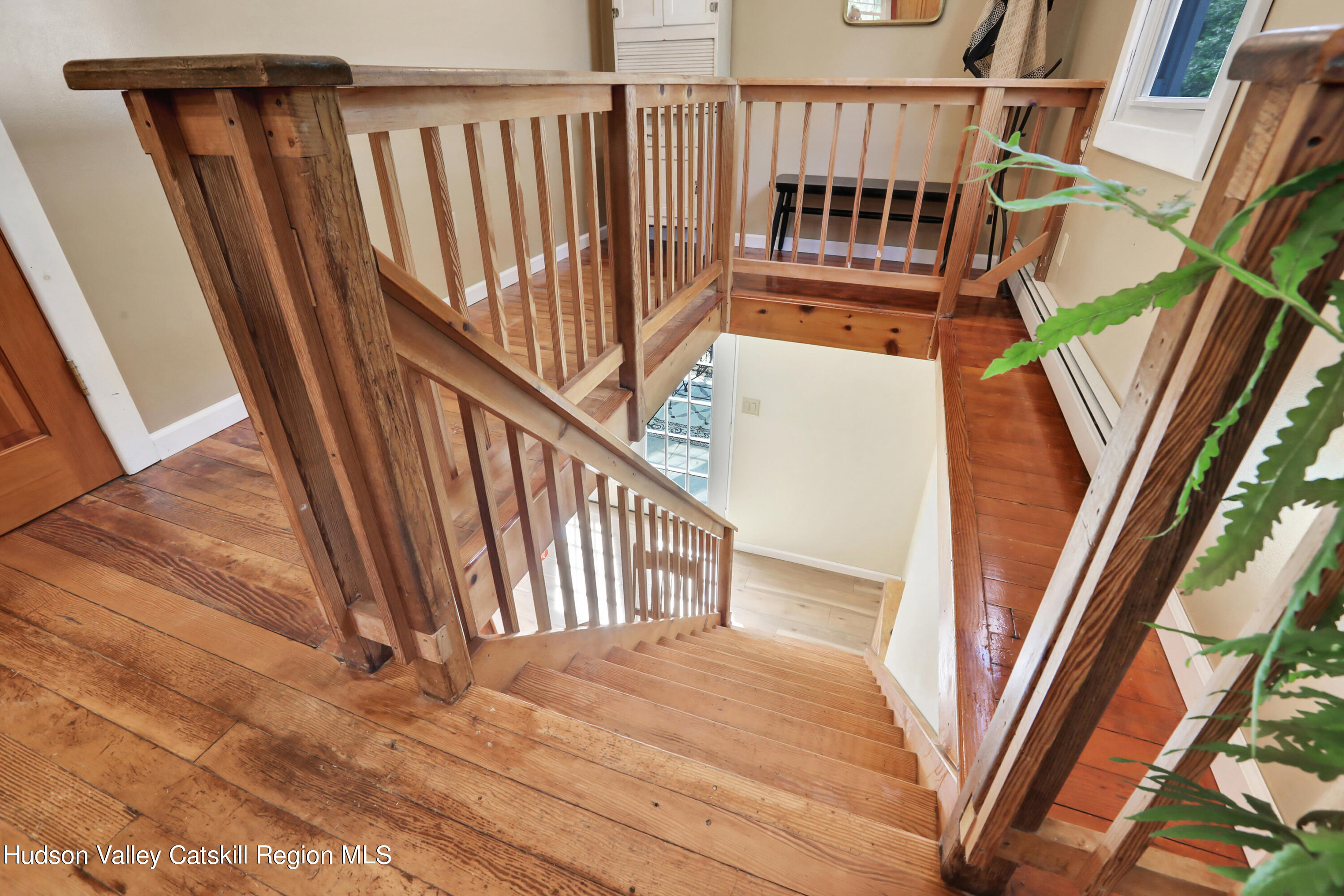 667 Albany Post Road New Paltz, NY 12561 - Photo 24 of 44 a view of staircase with railing and white walls