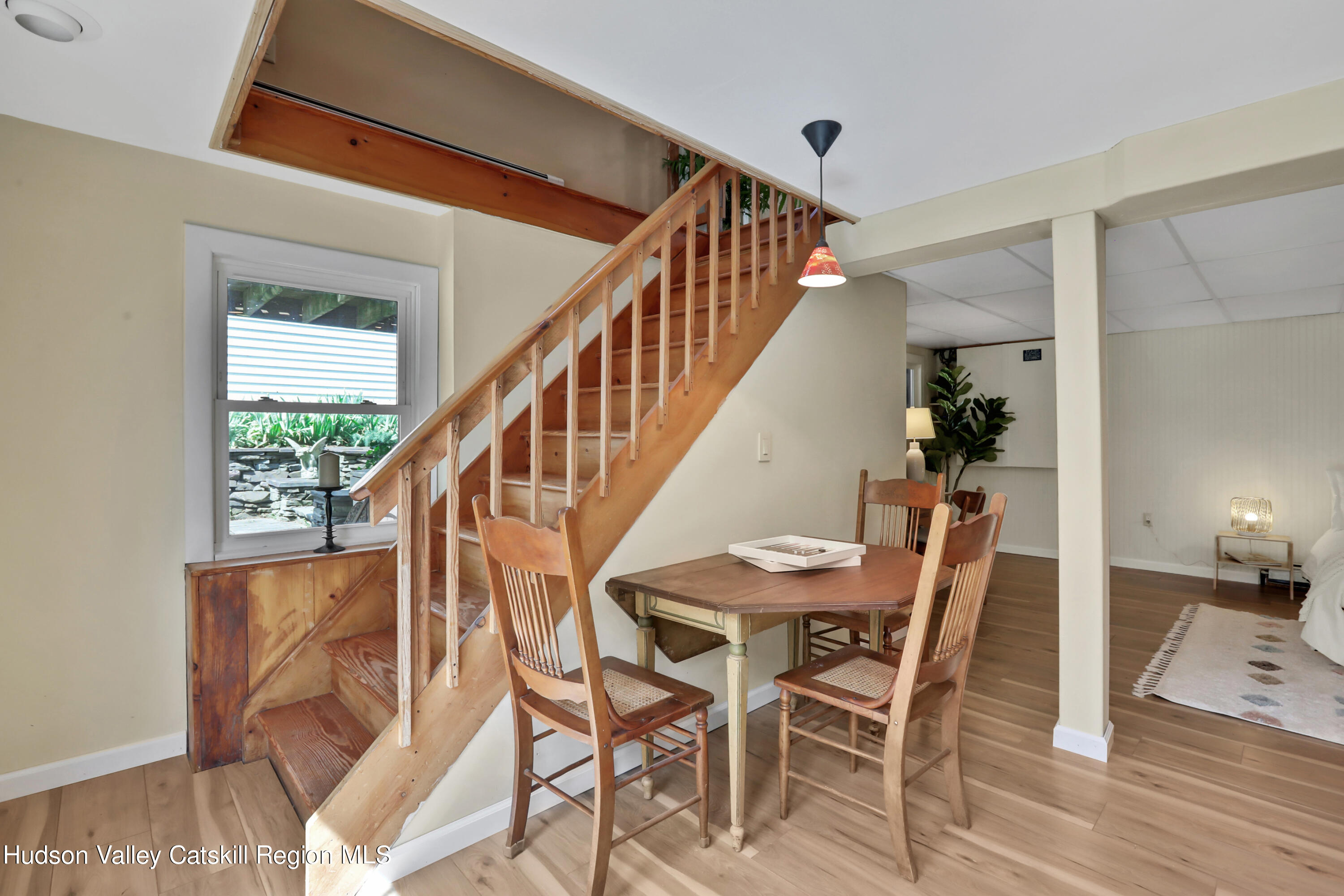 667 Albany Post Road New Paltz, NY 12561 - Photo 25 of 44 a view of a dining room with furniture and wooden floor