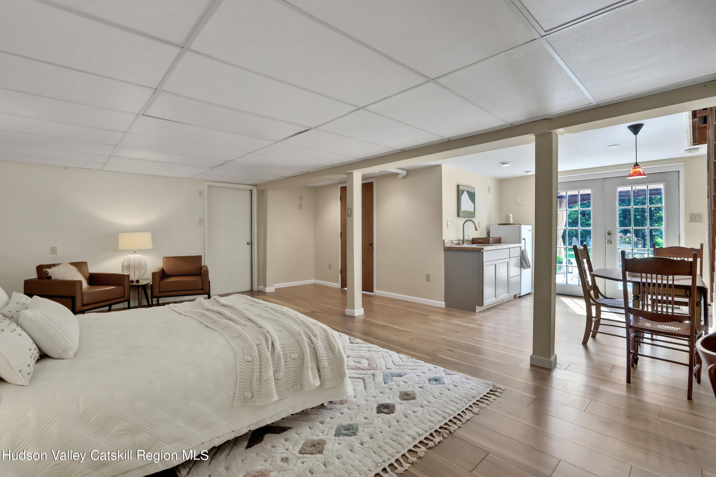 667 Albany Post Road New Paltz, NY 12561 - Photo 27 of 44 a spacious bedroom with two beds and a table