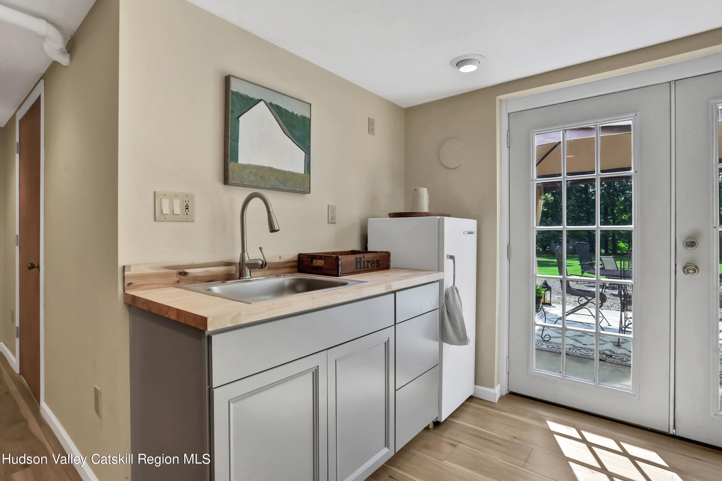 667 Albany Post Road New Paltz, NY 12561 - Photo 31 of 44 a kitchen with a sink stove and a refrigerator
