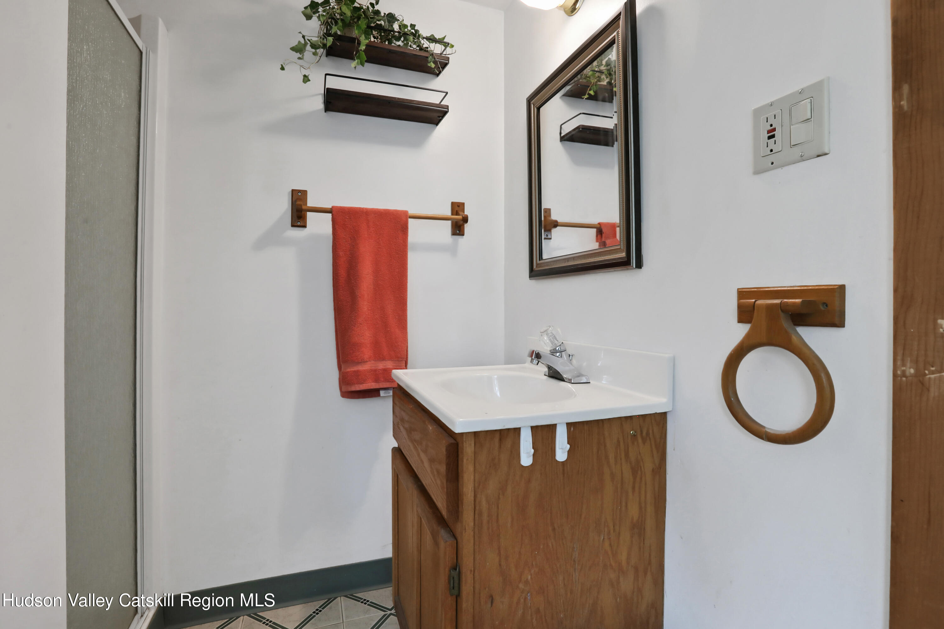 667 Albany Post Road New Paltz, NY 12561 - Photo 33 of 44 a bathroom with a toilet a sink and mirror