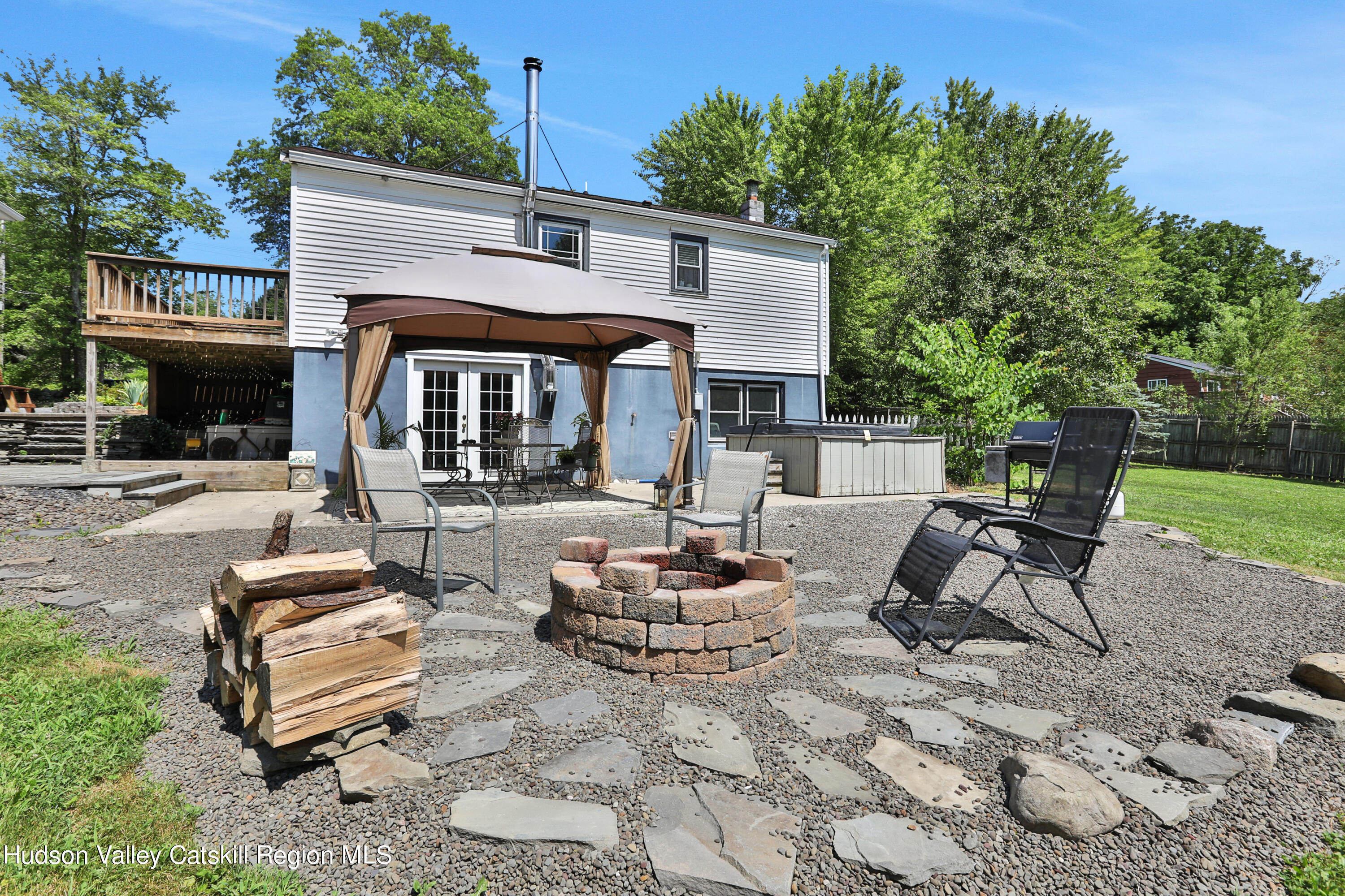 667 Albany Post Road New Paltz, NY 12561 - Photo 36 of 44 a front view of a house with garden and patio