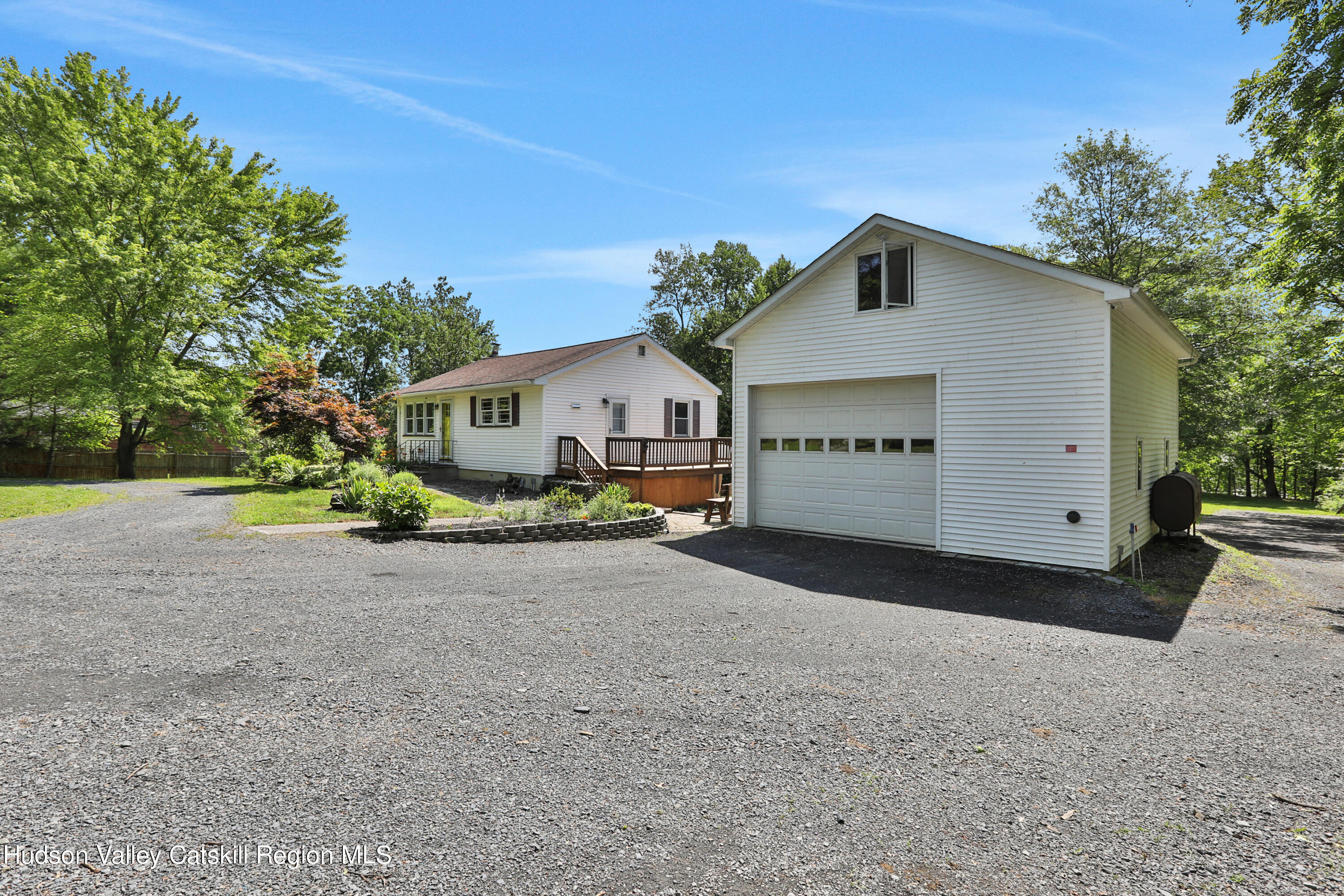 667 Albany Post Road New Paltz, NY 12561 - Photo 39 of 44 a view of a house with a yard and garage