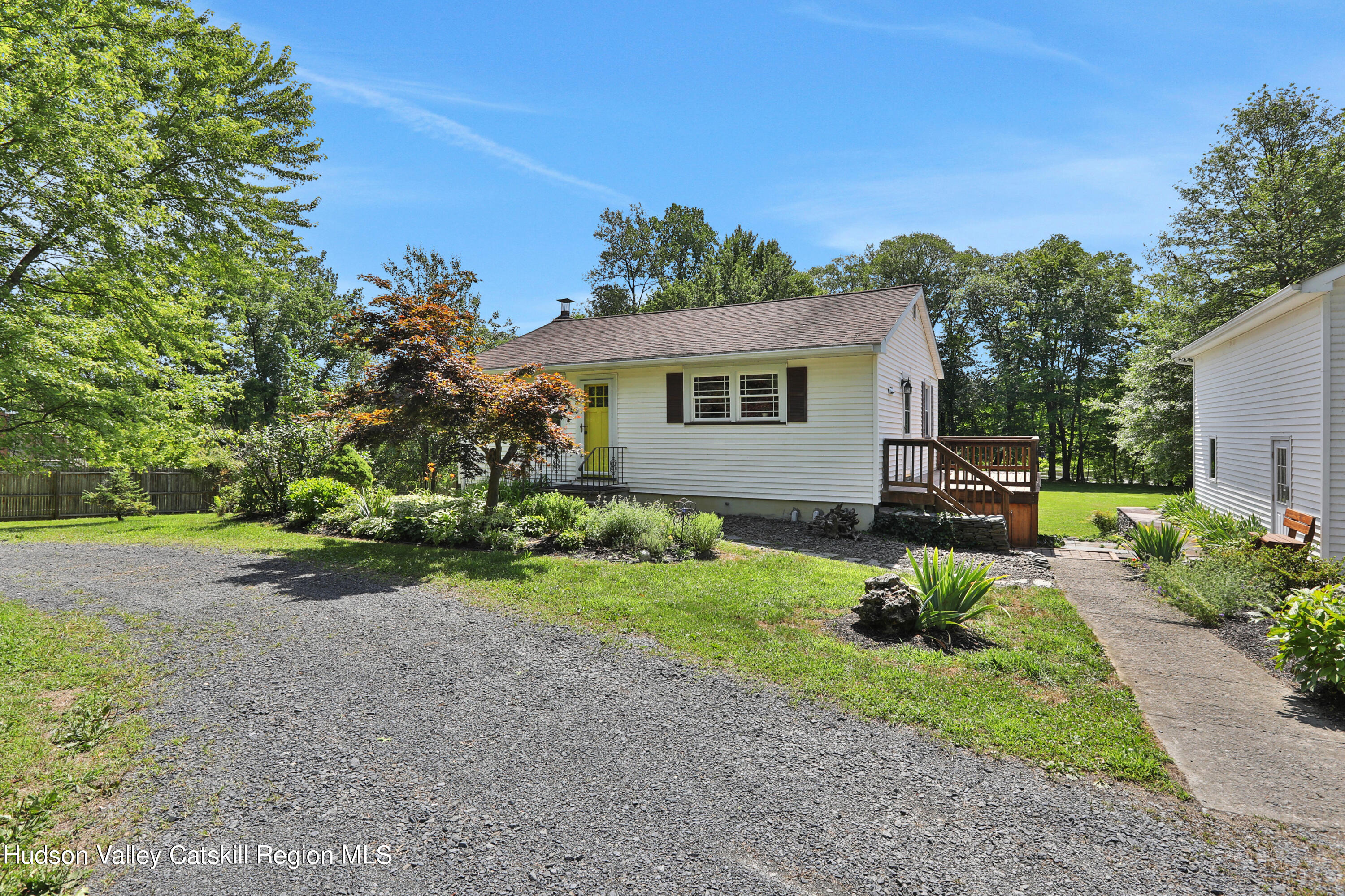 667 Albany Post Road New Paltz, NY 12561 - Photo 41 of 44 a front view of a house with a yard and a garage