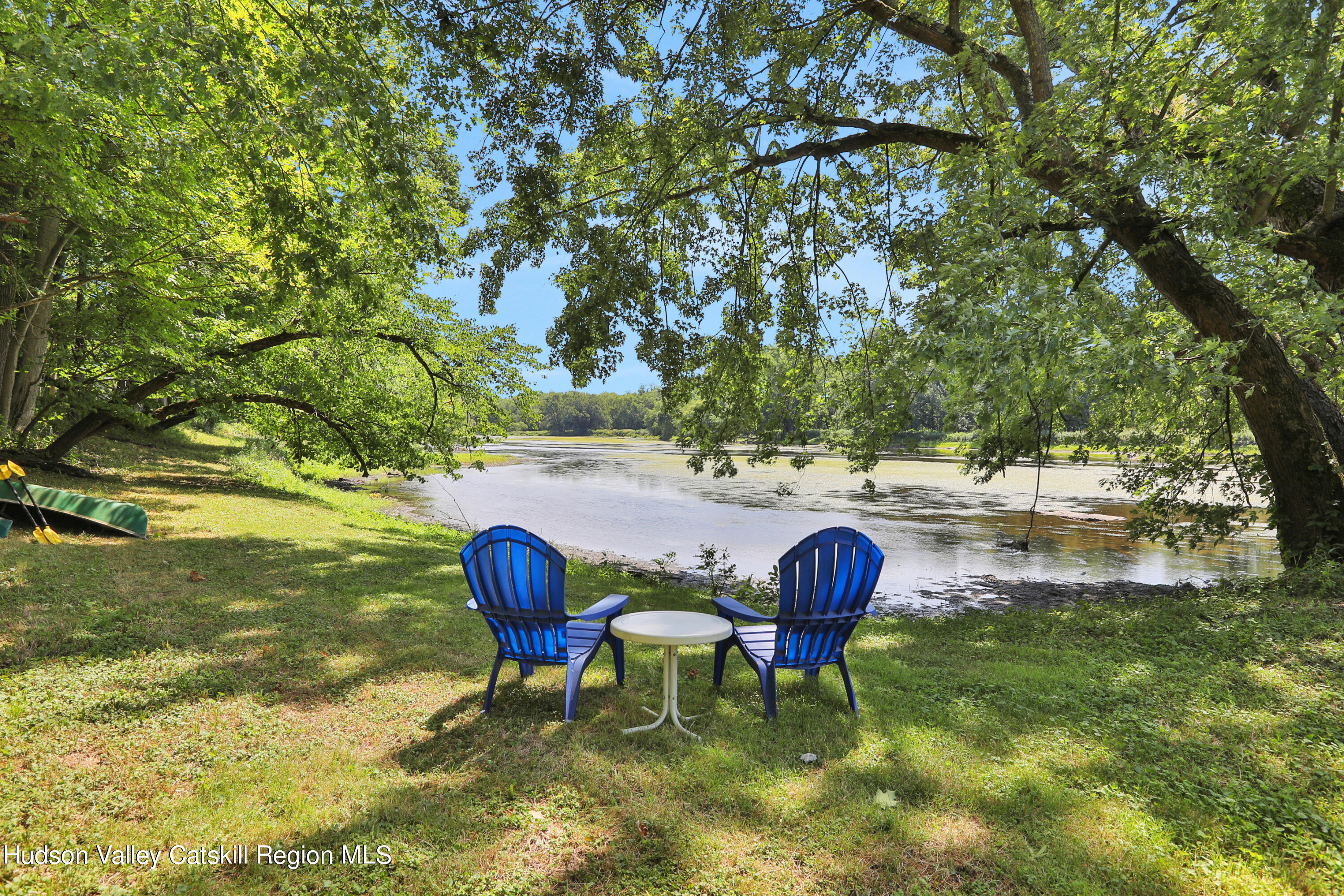 667 Albany Post Road New Paltz, NY 12561 - Photo 42 of 44 a backyard of a house with table and chairs